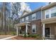 Attractive townhome boasting a stone facade, blue siding, and covered entrance at 7918 Nelson Rd, Mint Hill, NC 92227