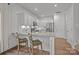 Modern kitchen featuring white cabinetry, stainless steel appliances, and granite countertops at 7918 Nelson Rd, Mint Hill, NC 92227