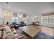 Bright living room with hardwood floors, large windows, and stylish furniture at 7918 Nelson Rd, Mint Hill, NC 92227