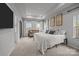 Spacious main bedroom with tray ceiling, plush carpeting, and natural light at 7918 Nelson Rd, Mint Hill, NC 92227