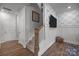 Cozy stairway with wood and white trim, leading to upper level with modern accents at 7918 Nelson Rd, Mint Hill, NC 92227