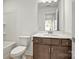 Neutral bathroom features a single vanity with a quartz countertop and a tub/shower combo at 9516 Coast Laurel Nw Ave, Concord, NC 28027