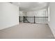 Second floor loft area with iron railing, carpet flooring, and view into the floor below at 9516 Coast Laurel Nw Ave, Concord, NC 28027