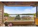 Relaxing balcony view overlooking a serene lake, perfect for enjoying the outdoors and nature at 9709 Emerald Point Dr # 6, Charlotte, NC 28278