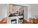 Well-lit kitchen featuring stainless steel appliances, breakfast bar, and ample counter space at 9709 Emerald Point Dr # 6, Charlotte, NC 28278