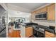 Open kitchen with breakfast bar flowing into the living area, ideal for entertaining and socializing at 9709 Emerald Point Dr # 6, Charlotte, NC 28278