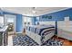 Bright main bedroom with a view of the water, hardwood floors, a ceiling fan, and a white bedframe at 9709 Emerald Point Dr # 6, Charlotte, NC 28278