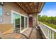 Cozy covered patio with a view, sliding glass door and outside decor at 9709 Emerald Point Dr # 6, Charlotte, NC 28278