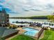 Community pool with views of the lake and boat docks at 9709 Emerald Point Dr # 6, Charlotte, NC 28278