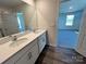 Bathroom featuring a double sink vanity with modern fixtures and a large mirror at 1054 Horizon Ln, Chester, SC 29706