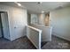 Upstairs hallway with white trim and neutral carpet that adds comfort at 1054 Horizon Ln, Chester, SC 29706