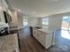Open kitchen with an island, stainless steel appliances, and a view of the living room at 1054 Horizon Ln, Chester, SC 29706