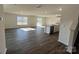 Spacious living room with wood floors, sliding glass doors, and an open kitchen at 1054 Horizon Ln, Chester, SC 29706