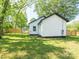 Rear exterior showcasing freshly painted siding, new fence, and well-maintained lawn in the backyard at 108 Graham St, Chester, SC 29706