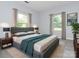 A stylish and bright bedroom featuring a king bed, large windows, and modern decor at 108 Graham St, Chester, SC 29706