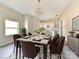 Elegant dining room with a stylish chandelier, seating for eight, and a view to the kitchen at 108 Graham St, Chester, SC 29706