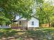 Charming home featuring a welcoming front porch and a classic white exterior with dark trim at 108 Graham St, Chester, SC 29706