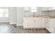 An eat-in kitchen is newly remodeled with white cabinets, new countertops, sink and faucet at 108 Graham St, Chester, SC 29706
