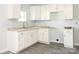 Bright kitchen features new white cabinets and countertops at 108 Graham St, Chester, SC 29706