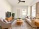 Bright living room featuring modern decor, a cozy sofa, and neutral tones for a welcoming space at 108 Graham St, Chester, SC 29706