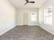 A bright empty living room features grey floors, large windows, and white walls at 108 Graham St, Chester, SC 29706
