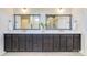 Double sink bathroom vanity featuring framed mirrors and contemporary fixtures at 11144 Limehurst Pl, Charlotte, NC 28278