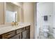 Well-lit bathroom featuring a vanity with solid surface countertops and access to the shower at 11144 Limehurst Pl, Charlotte, NC 28278