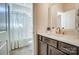 Stylish bathroom showcasing a shower-tub, vanity with solid surface countertop, and a modern faucet at 11144 Limehurst Pl, Charlotte, NC 28278