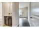 Modern bathroom showcasing a vanity with a solid surface countertop and view into the bedroom at 11144 Limehurst Pl, Charlotte, NC 28278