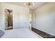 Bright bedroom with stylish lighting, a comfortable bed, and en suite bathroom at 11144 Limehurst Pl, Charlotte, NC 28278