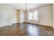 Spacious bedroom with wood floors, neutral walls, and ample natural light at 11144 Limehurst Pl, Charlotte, NC 28278