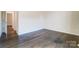 Bright bedroom with hardwood flooring, natural light, and neutral paint, offering a modern aesthetic at 11144 Limehurst Pl, Charlotte, NC 28278