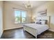 Cozy bedroom featuring a large window and stylish decor at 11144 Limehurst Pl, Charlotte, NC 28278
