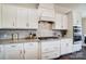Bright kitchen featuring stylish white cabinetry, stainless steel appliances, and subway tile backsplash at 11144 Limehurst Pl, Charlotte, NC 28278