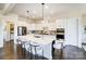 Bright eat-in kitchen featuring stainless appliances, quartz countertops, and a large center island at 11144 Limehurst Pl, Charlotte, NC 28278