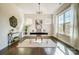 Bright home office space with a large window, modern desk, and stylish decor at 11144 Limehurst Pl, Charlotte, NC 28278