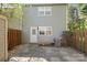 Cozy backyard featuring a small patio, windowed door and low fence line at 1205 Scaleybark Rd # A, Charlotte, NC 28209