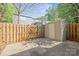 Fenced backyard with storage shed and concrete patio provides private outdoor space at 1205 Scaleybark Rd # A, Charlotte, NC 28209