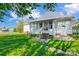 Exterior view of home featuring access to the backyard and sunroom, showcasing the outdoor living space and entrance at 130 Atwell Rd, Mt Ulla, NC 28125