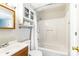 Bright bathroom featuring a shower and bath tub combo with white tile and a wooden vanity at 130 Atwell Rd, Mt Ulla, NC 28125