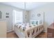 Bright bedroom with a patterned comforter and plenty of natural light at 130 Atwell Rd, Mt Ulla, NC 28125