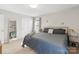 Cozy bedroom with neutral walls, carpet flooring, and soft, natural light from a window at 130 Atwell Rd, Mt Ulla, NC 28125