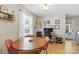 Comfortable dining area with a round table, four chairs, and a window for ample natural light at 130 Atwell Rd, Mt Ulla, NC 28125