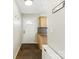 Inviting entryway with a 'HELLO THERE' sign, coat hooks, tiled floor and a convenient storage bench at 130 Atwell Rd, Mt Ulla, NC 28125