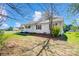 A charming single-story home with neutral siding nestled on a well-maintained lawn and mature trees at 130 Atwell Rd, Mt Ulla, NC 28125