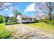 Charming single-story home with a quaint covered parking area surrounded by a well-maintained lawn at 130 Atwell Rd, Mt Ulla, NC 28125