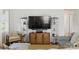 Comfortable living room featuring sofas, TV and decorative cabinets for a relaxing space at 130 Atwell Rd, Mt Ulla, NC 28125