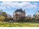 Expansive backyard featuring a spacious deck and well-maintained lawn for outdoor enjoyment at 13833 Jonathans Ridge Rd, Mint Hill, NC 28227