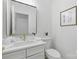 Modern bathroom with a marble-top vanity, white sink, and gold faucet at 13833 Jonathans Ridge Rd, Mint Hill, NC 28227