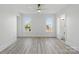 Bright bedroom with wood floors, white walls and two windows at 13833 Jonathans Ridge Rd, Mint Hill, NC 28227